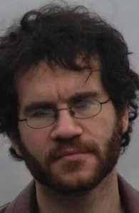 Том Бисселл